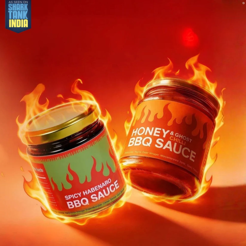 Two jars of BBQ sauce with flames on a red background, featuring 'Shark Tank India' logo.