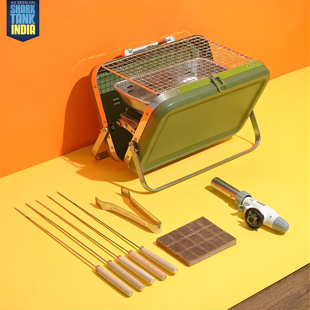 Portable grill with accessories on a yellow surface, featuring the Shark Tank India logo.